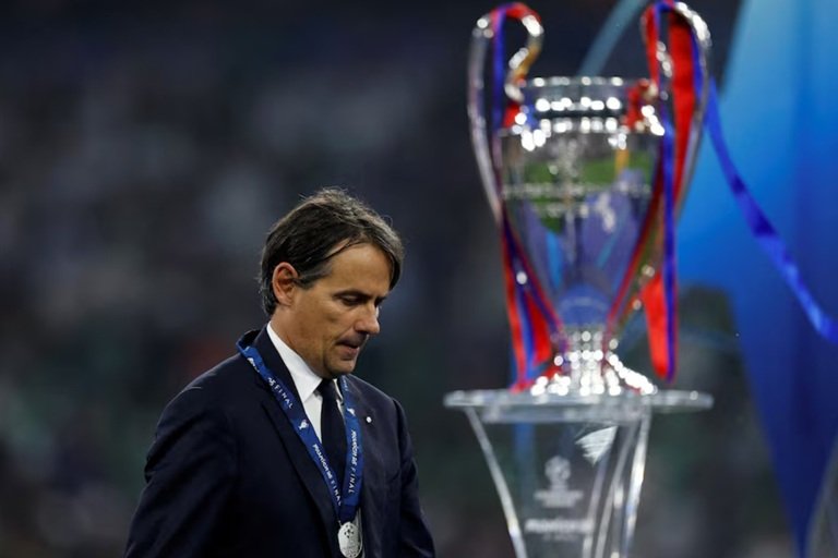 Inzaghi leaves Inter after Champions League final humiliation Simone Inzaghi walks past the Champions League trophy after Inter Milan were humiliated by PSG in Munich