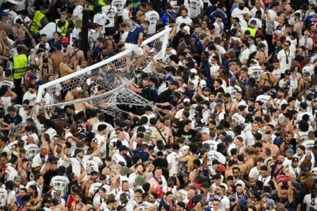 UEFA fines PSG Paris St Germain fans invade the pitch as one fan climbs on the goal after winning the Champions League REUTERS