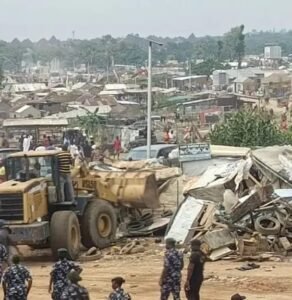 Demolition of roadside shanties at Sango Tollgate by Ogun State officials to reduce accidents