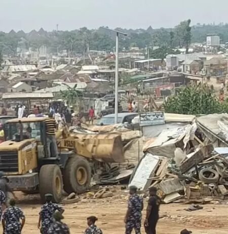 Demolition of roadside shanties at Sango Tollgate by Ogun State officials to reduce accidents