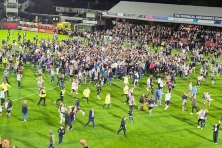 Grimsby fans flock field after kick Man United out of Carabao Cup