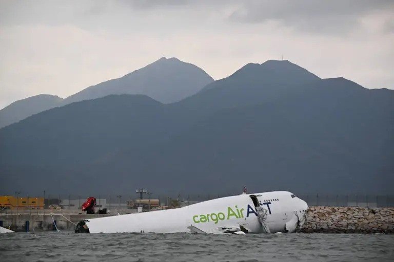 Cargo plane skids off Hong Kong runway, kills two