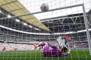 Enzo Fernandez heads in Pedro Neto’s cross to put Chelsea ahead against Leeds.