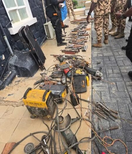 Recovered fabricated AK-47 rifles and weapon-making tools displayed after security raid in Plateau state.