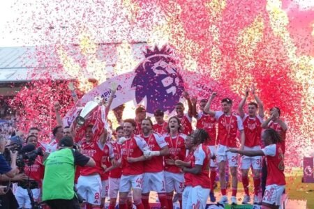 Arsenal players celebrate after defeating Crystal Palace at Selhurst Park as the newly crowned Premier League champions.