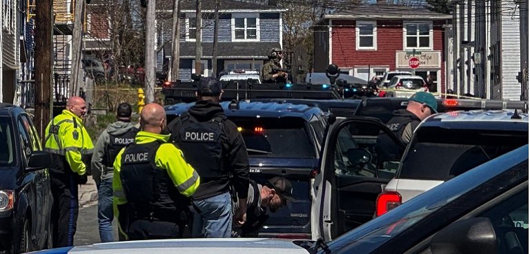 Police deploy flash bangs, armoured vehicle in St. John’s drug raid RCMP tactical armoured vehicle and heavily armed officers outside a Spencer Street home during a police raid in downtown St. John’s.