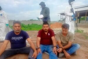 NDLEA operatives at a clandestine methamphetamine laboratory uncovered in Ogun forest with seized chemical substances and suspects.