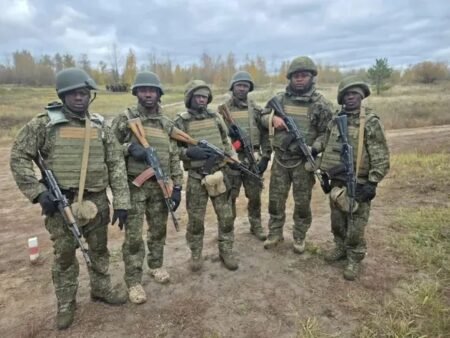 Six Nigerians, inlcuding a former member of the Nigerian AirForce, wielding Russia's AK74M and reportedly fighting for the Russian Army.
