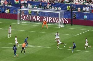 Kylian Mbappe takes a shot and scores for France in win over Iraq