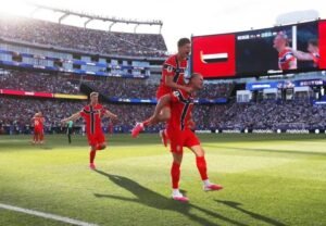 Norway striker Erling Haaland celebrates after scoring one of his two goals during a 4-1 World Cup Group I victory over Iraq.
