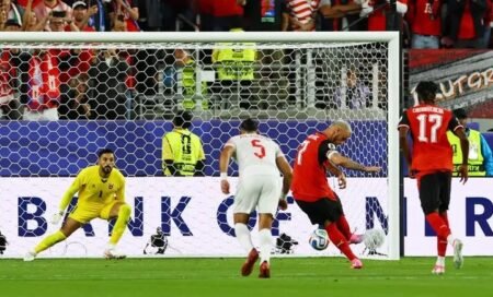 Austria's Marko Arnautovic scores their third goal from the penalty spot
