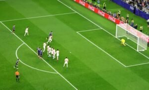Argentina's Lionel Messi scores their third goal from a free kick past Jordan's Yazeed Abulaila
