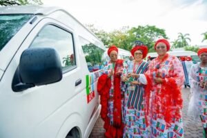 Oluremi Tinubu announcing donation of cars to APC women leaders at a formal event in Abuja, emphasizing women empowerment and party mobilisation.