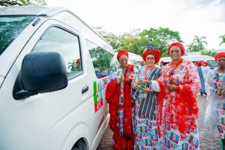 Oluremi Tinubu announcing donation of cars to APC women leaders at a formal event in Abuja, emphasizing women empowerment and party mobilisation.