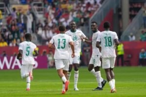 Senegal players celebrate during their emphatic 5-0 victory over 10-man Iraq in a FIFA World Cup Group I match.