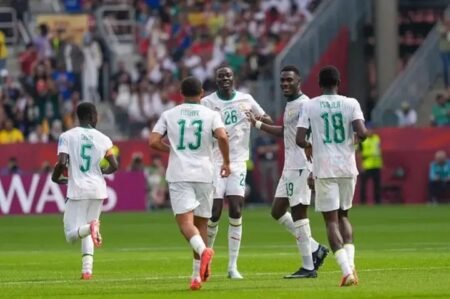 Senegal players celebrate during their emphatic 5-0 victory over 10-man Iraq in a FIFA World Cup Group I match.