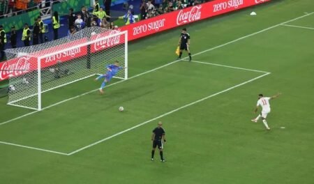 Morocco's Ismael Saibari scores a penalty during the shootout to win the match as Morocco qualify for the round of 16 stage of the World Cup