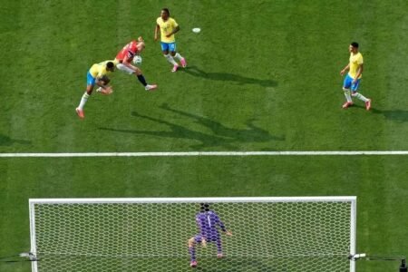Erling Haaland powers a header past Brazil's defence to score Norway's opening goal in their 2-1 FIFA World Cup last-16 victory.