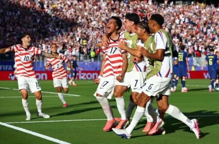 Ten-man US beat Bosnia 2-0 to reach round of 16 Malik Tillman of the US celebrates scoring their second goal with teammates