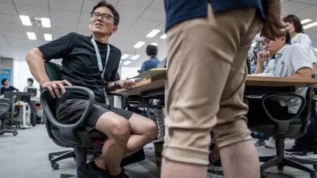 Japanese office workers wearing shorts as part of Tokyo's Cool Biz summer workplace dress code initiative.