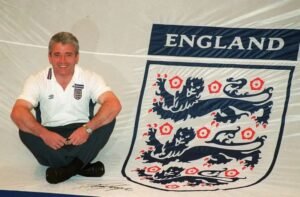 Football icon Kevin Keegan dies aged 75 England's manager Kevin Keegan poses with with a giant England Shirt which will be used by the fans