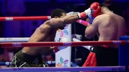Anthony Joshua punches Kristian Prenga during their heavyweight fight, rallying from two first-round knockdowns to secure a second-round knockout victory and extend his record to 30-4.