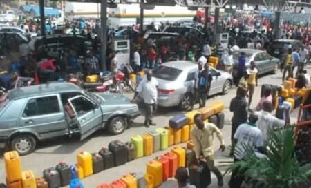 Nigerians groan as petrol hits N1,400/litre, transport fares rise Motorists queue at a Nigerian filling station as petrol prices rise to N1,400 per litre, triggering transport fare increases nationwide.