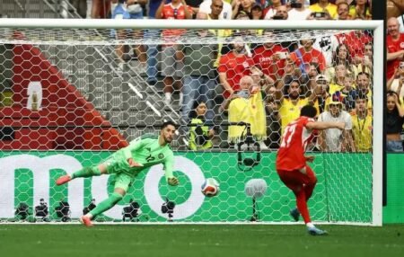 Switzerland's Ruben Vargas scores a penalty past Colombia's Camilo Vargas to win the penalty shootout