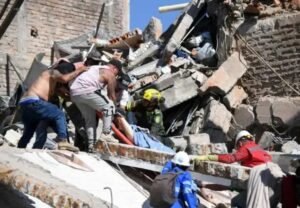 Rescuers search through rubble after a powerful earthquake in Pereira, Colombia.