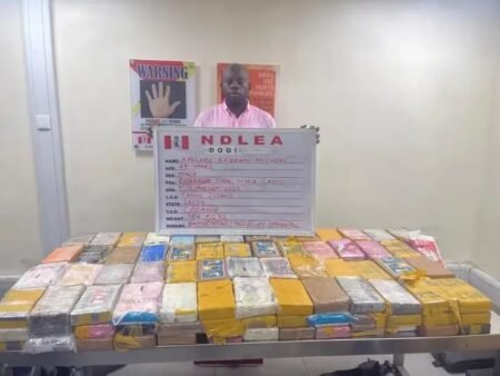 NDLEA officials display 184.5kg cocaine seized from a courier company in Lagos
