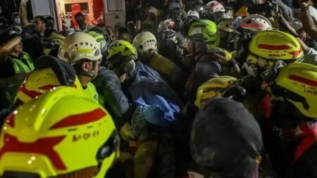 Rescue workers free Daniela Largo after 36 hours trapped beneath rubble following a powerful earthquake in Colombia.