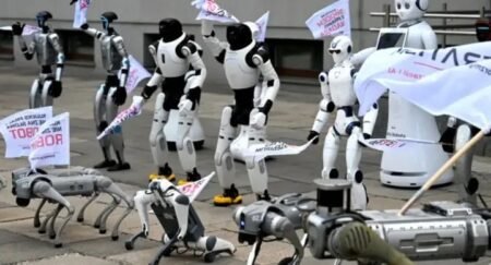 Humanoid and quadruped robots march through Warsaw during a protest calling for AI regulation and worker protection.