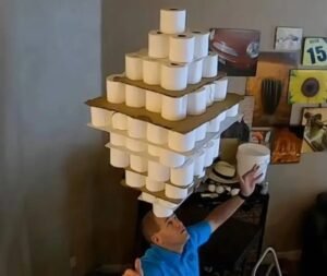 David Rush balances 254 toilet paper rolls to break Guinness World Record David Rush balances 254 toilet paper rolls on his head in a Guinness World Records attempt
