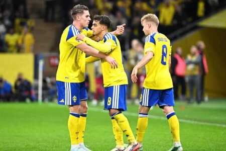 Sweden's Viktor Gyokeres celebrates scoring their first goal with Yasin Ayari and Daniel Svensson Fredrik Sandberg